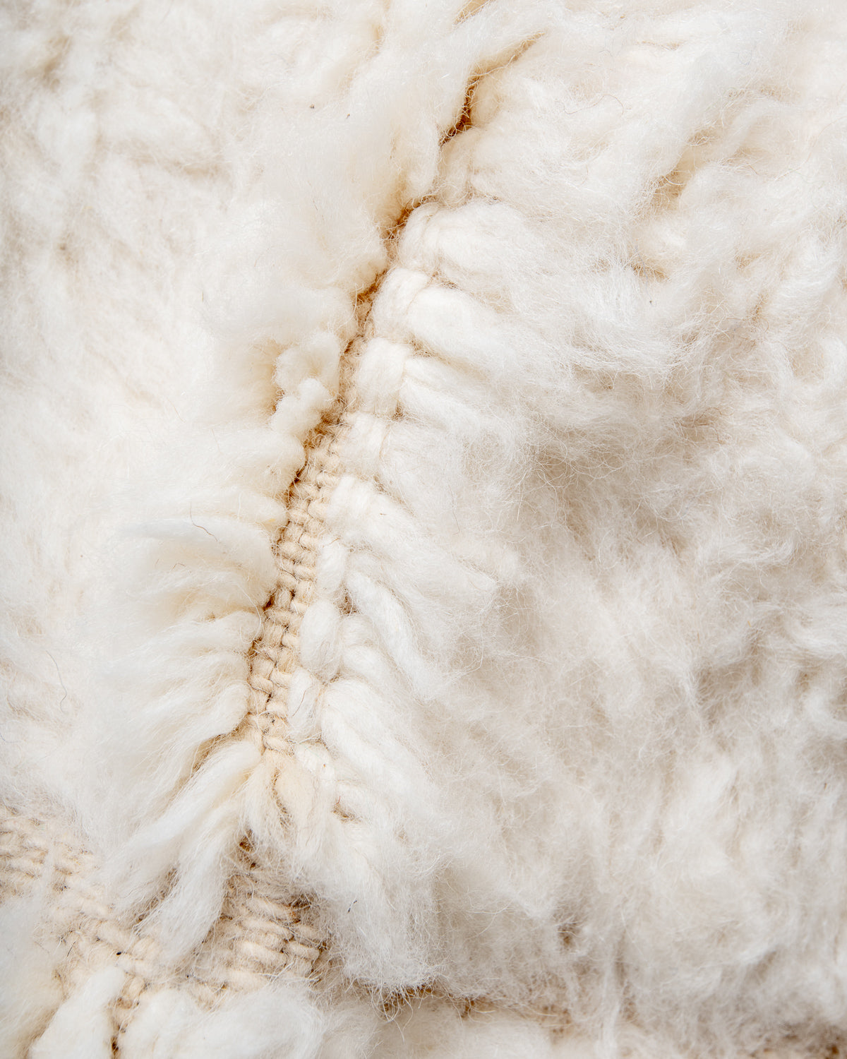 Modern, designer, handcrafted Berber rug from Morocco. Beniourain carpet with minimalist design, natural wool pile and a fluffy texture.